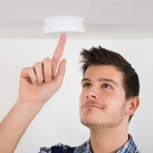 CLICK-A-PRO Service Tech Changing Batteries In A Smoke Detector