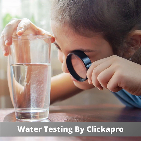 A girl inspecting a glass of water with a magnifying glass. The caption in the image says "Water Testing By Clickapro"