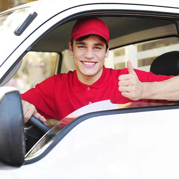 A home service professional leaning out his work van and giving the thumbs up. Get more service jobs by listing your service at clickapro.com