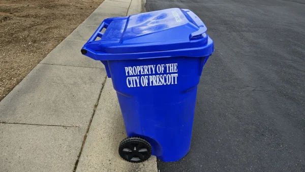 Blue City of Prescott Trash Bin at Curb awaiting collection